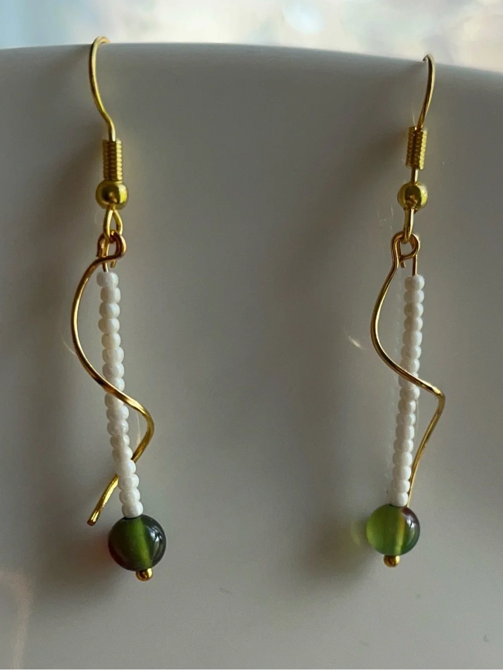 Dainty Drop Gold-toned Wavy Metal Design Adorned | White & Olive Grean Jade Bead